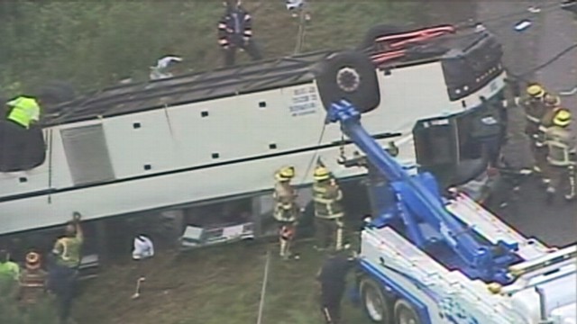 VIDEO: A commercial tour bus overturned near Kings Dominion theme park.